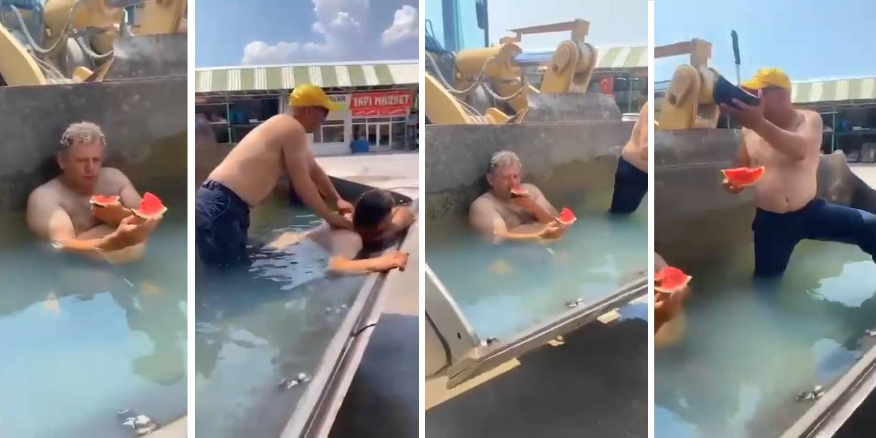 Sıcaktan bunalan işçiler, iş makinesinin kovasına doldurdukları suda serinledi