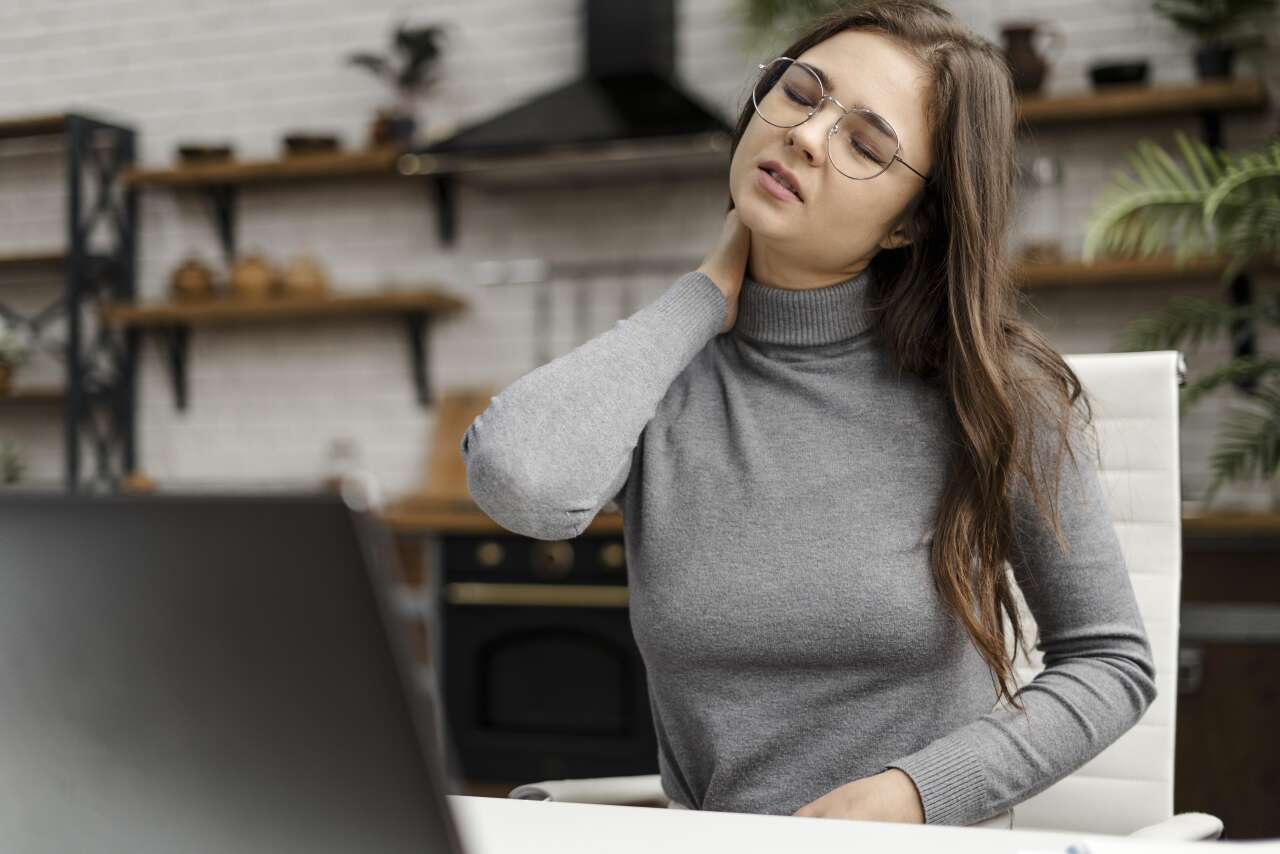 1774511907-young-woman-having-neckache-while-working-from-home