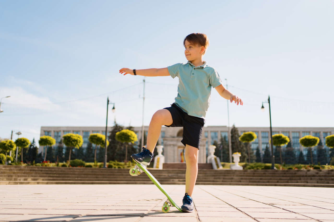 1780299746-happy-young-boy-playing-skateboard-park-caucasian-kid-riding-penny-board-practicing-skateboard